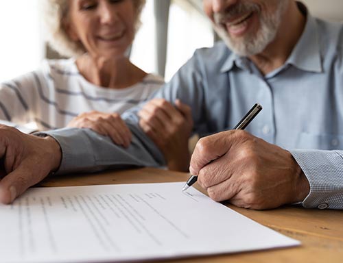 an older couple making a planned giving donation